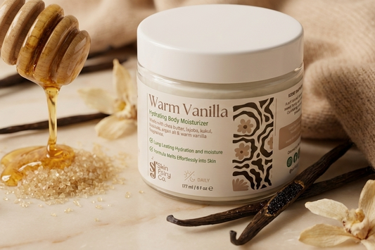 Warm Vanilla body moisturizer jar with honey, vanilla beans, and flowers on a wooden surface